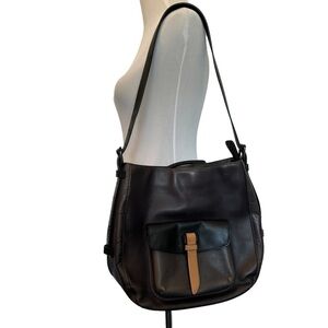 Tumi unisex leather travel bag.